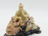 an image of a figurine of a man sitting on top of a turtle