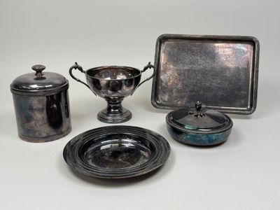 several pieces of silverware are sitting on a white surface
