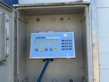 a metal box with a digital meter in it