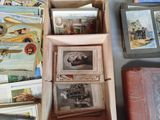 a box full of old postcards on a table