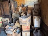 a pile of boxes in a room with a door