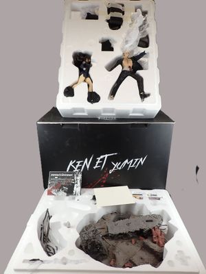 the box is open with two action figures inside of it