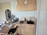 a small kitchen with a table and chairs in it