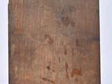 an old wooden box with a picture of a man on it