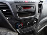 a dashboard of a car with a radio and a steering wheel
