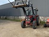 a picture of a forklift parked in front of a building