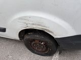 a white van that has a flat tire on the side of it
