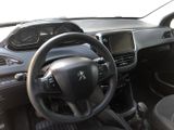 the interior of a small car with a steering wheel and dashboard