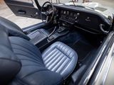 a view of the inside of a car from the driver ' s seat