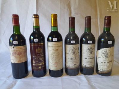 six bottles of wine are lined up in a row on a table