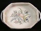 a white plate with a floral design on it