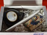 a bottle of liquor and a lighter in a box