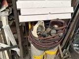 a pile of junk in a garage next to a fire hydrant