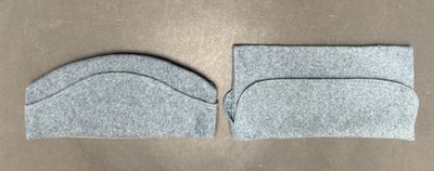 two pieces of felt sit on top of each other on a table