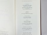 an open book with a menu on it sitting on a table