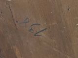 a close up of a brown vase with writing on it