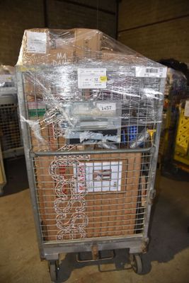 a metal cart with a bunch of boxes on top of it
