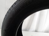 a close up of a tire on a white surface with a white background