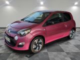 a picture of a pink smart car in a showroom
