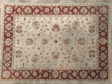 an image of a rug with a red border on a wooden floor