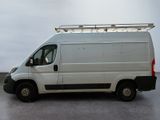 a white van that is parked in a parking lot