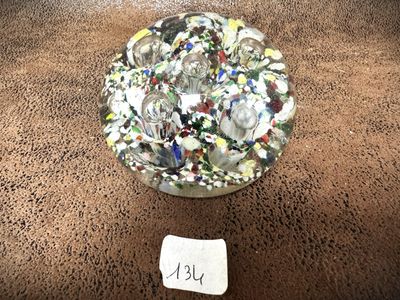 a glass bowl filled with lots of small pieces of glass