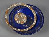 a blue bowl with a decorative design on it