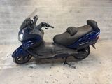 a scooter that is parked in a garage