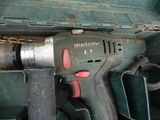 a cordless drill that is sitting in a box