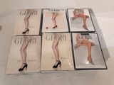 six dvds of a woman ' s legs in stockings and high heels