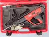 a red tool case with tools in it on a table
