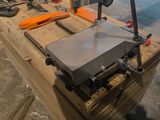 a machine that is sitting on top of a wooden table