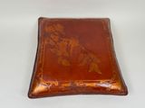brown leather box with floral design on it