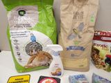 a bag of cat food, a bag of catnip, a bag of catnip, a bottle of catnip, a bottle of