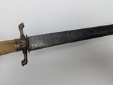 an image of a knife with a wooden handle on a white surface