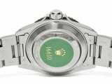 a close up of a watch with a green face on a bracelet