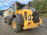 a picture of a construction vehicle parked in a parking lot