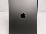 a close up of the back of an ipad on a white surface