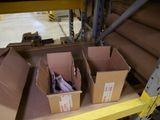 three boxes that are on a shelf in a warehouse