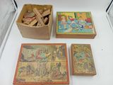 four wooden puzzles in a box on a table