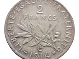 une image représentant une pièce d'argent sur laquelle figure une branche d'olivier
