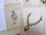 several pieces of jewelry are displayed on a white surface