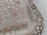 a silver tray that has a handle on it