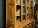 an image of a wooden china cabinet with glass doors