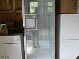 a refrigerator with a glass door in a kitchen