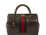 a brown leather handbag with a green and red stripe on the side
