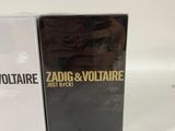 two boxes of perfume sitting next to each other on a table