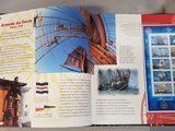 an open book with pictures of ships on it