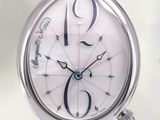 a close up of a wrist watch with a white dial