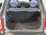 two seats in the back of a car with the trunk open